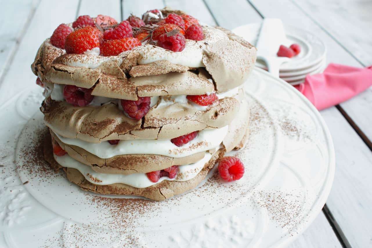 Chocolate meringue cake with strawberries and raspberries